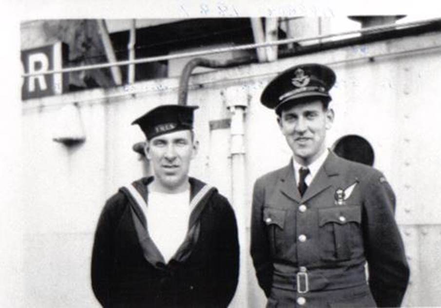 A couple of men in military uniforms
Description automatically generated
